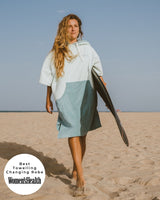 Lead_women Woman wears a Vivida Original Adult Poncho Towel Changing Robe - Seafoam Green. Sticker reads Women's Health's Best Towelling Changing Robe