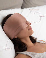 Woman wearing a Silk Blackout Eye Mask - Misty Rose
