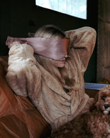 Woman wearing a Silk Blackout Eye Mask - Misty Rose