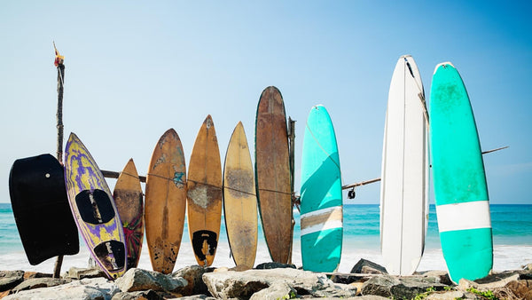 Three Surfboards Against A Wall
