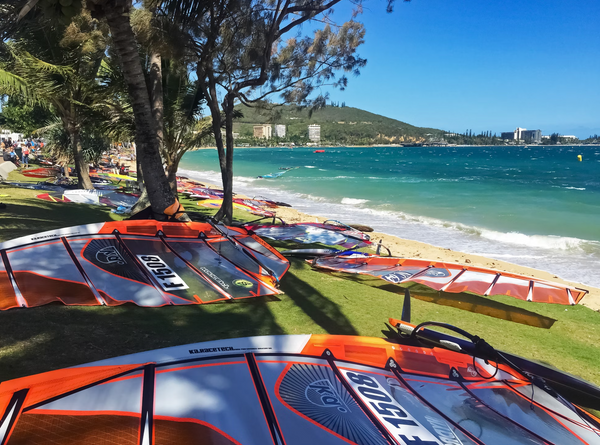 Windsurf sails lying on a bank by the sea