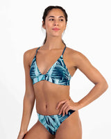 Woman wearing a Vivida Imperfect Hermosa Reversible Bikini Top - Bamboo Tropics
