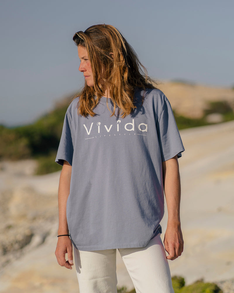 Lead woman wearing a Vivida Lifestyle Classic Tee T-Shirt Celestial Blue 