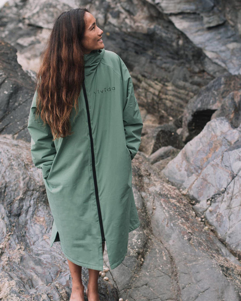 Lead Woman wearing a Vivida sherpa weatherproof changing robe Green
