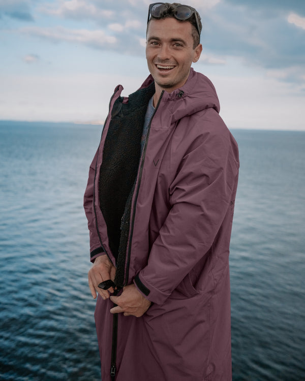 Lead_men - Man wearing a Vivida sherpa weatherproof changing robe Purple Dusky Damson