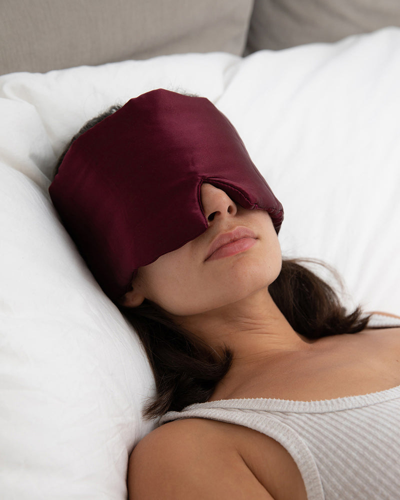 Lead_women woman wearing a Vivida Silk Blackout Sleep Eye Mask - Burgundy Berry