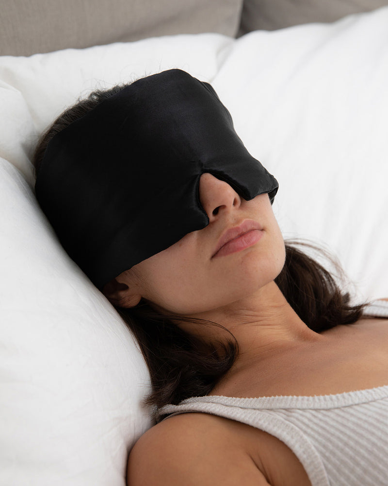 Lead_women woman wearing a Vivida Silk Blackout Sleep Eye Mask - Midnight Black