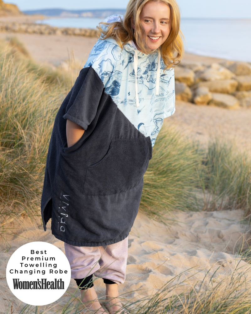 Lead_women - Woman wearing a Vivida Premium Poncho Towel Changing Robe - Cloud Blue Map of Dreams