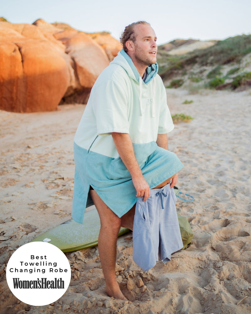 Lead_men - man wears a Vivida Original Poncho Towel Changing Robe - Seafoam Green