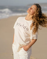 Lead woman wearing a Vivida Lifestyle Classic Tee T-Shirt Beach Ivory