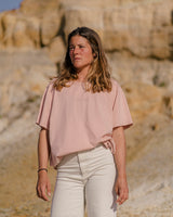 Lead woman wearing a Vivida Lifestyle Classic Tee Embroidered T-Shirt misty rose