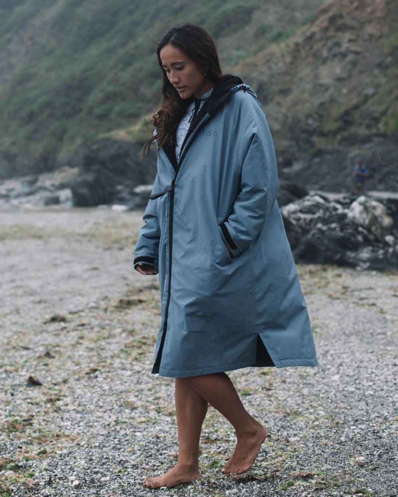 Lead Woman wearing the All Weather Sherpa Changing Robe