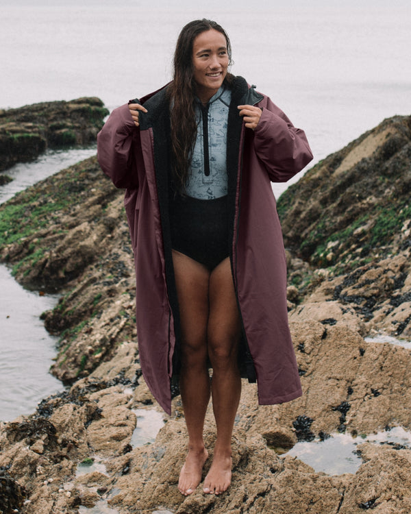 Lead_women - Woman wearing a Vivida sherpa weatherproof changing robe Purple Dusky Damson