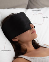 Woman wearing a Silk Blackout Eye Mask - Midnight Black