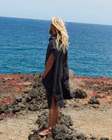 Man wearing a Vivida Essential Poncho Towel Black