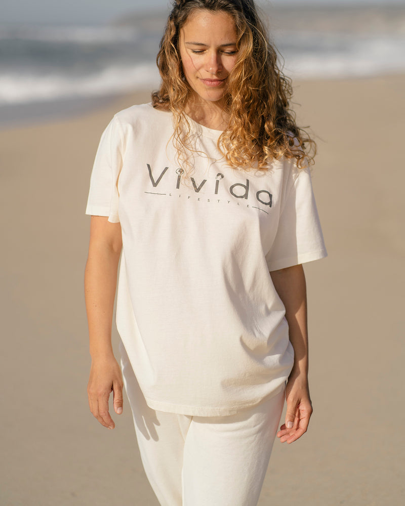 Woman wearing a Vivida Lifestyle Classic Tee T-Shirt Beach Ivory