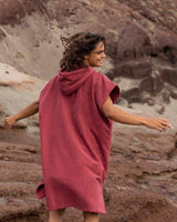 Lead_women2 - Woman running wearing Essential Poncho Towel Changing Dry Robe Rhubarb Red