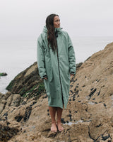 Woman wearing the Sherpa Fleece All Weather Changing Robe Green