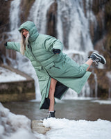 Lead_Women2 - woman wearing a Vivida All Weather Puffer Changing Robe in Aventurine Green