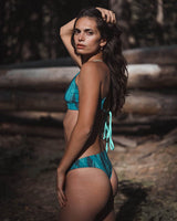 Woman wearing Hermosa Surf Bikini Top and Bottoms Midnight Feather