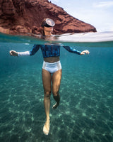 Woman wearing Women of the Sea Surf Bikini Bottoms White