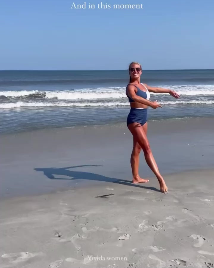 Ballet dancer in bikini on beach