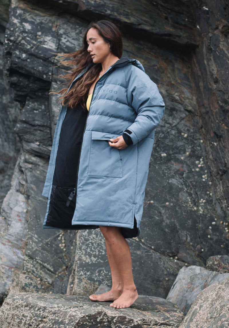 Woman wearing All Weather Waterproof Changing Dry Robe Mineral Blue