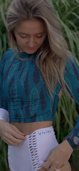 Woman wearing Women of the Sea Rashguard Midnight Feather
